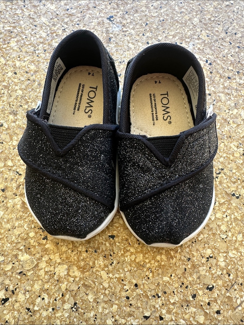 TOMS Kids Glitter Slip-On Sneakers in Black Toddler size 4